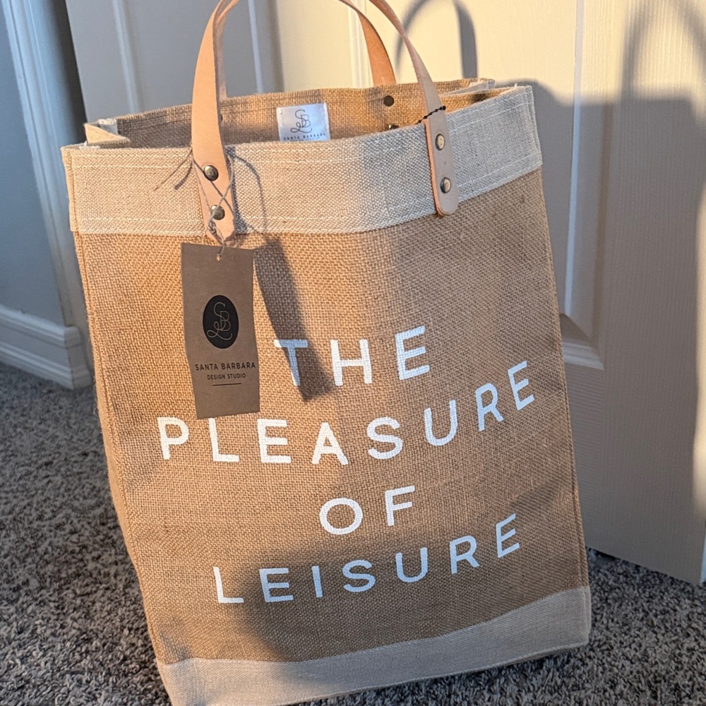 Santa Barbara Design Studio "The Pleasure of Leisure" Jute Tote - Tan & Cream